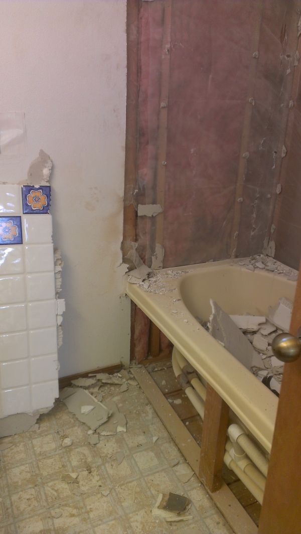In progress-the yanking of the old jetted tub and hacienda tile.